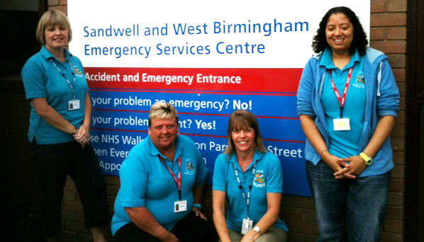 Sandwell I.M.P.S. trainers by the entrance to Sandwell hospital