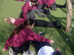 Practising the recovery position at Long Furlong Primary School