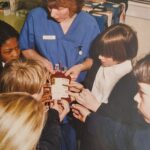 children looking at a unit of blood